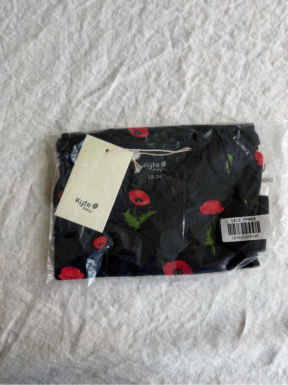 Kyte Baby Black Poppy-Print Longsleeve bodysuit